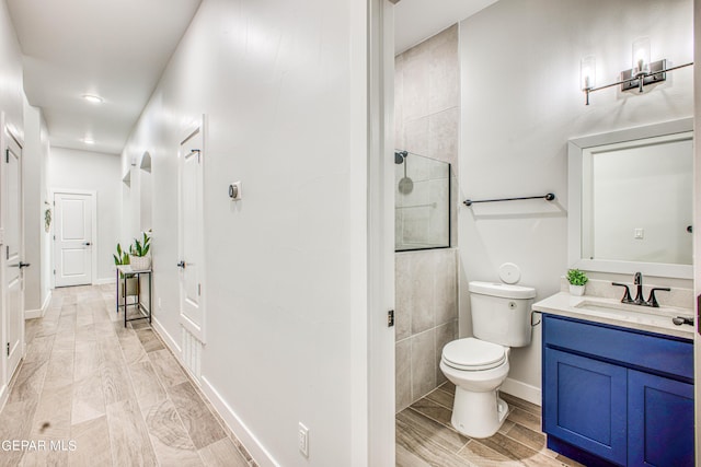 309 Blue Vly, El Paso, TX 79928 - bathroom with tiled shower, toilet, vanity, and recessed lighting