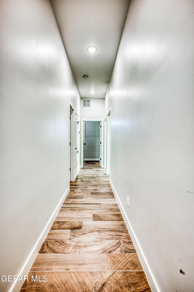 309 Blue Vly, El Paso, TX 79928 - corridor with light wood-style flooring and baseboards