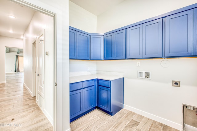 309 Blue Vly, El Paso, TX 79928 - laundry area featuring hookup for an electric dryer, cabinet space, washer hookup, light wood-style flooring, and baseboards
