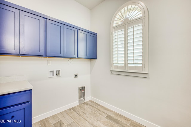 309 Blue Vly, El Paso, TX 79928 - laundry area featuring cabinet space, hookup for an electric dryer, baseboards, hookup for a washing machine, and gas dryer hookup