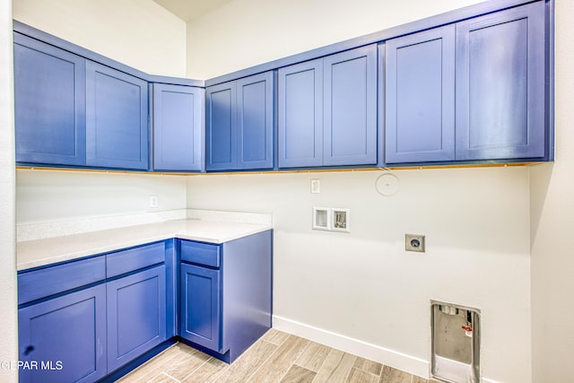 309 Blue Vly, El Paso, TX 79928 - washroom with cabinet space, hookup for an electric dryer, light wood-style flooring, baseboards, and hookup for a gas dryer