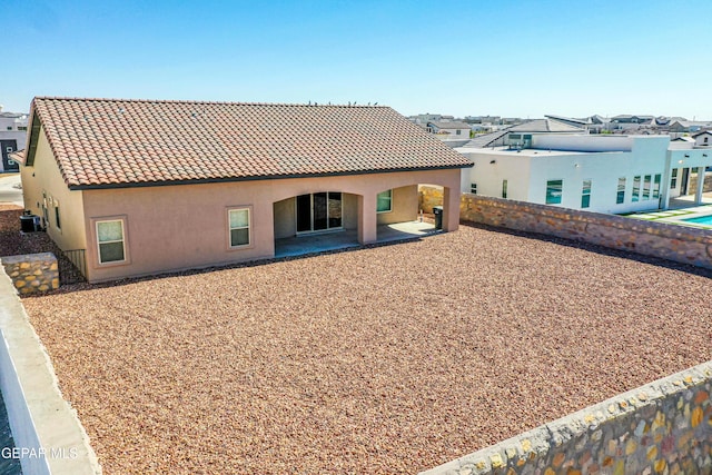 309 Blue Vly, El Paso, TX 79928 - back of house featuring a tiled roof, stucco siding, cooling unit, a patio area, and a residential view