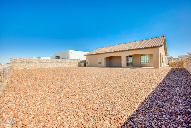 309 Blue Vly, El Paso, TX 79928 - rear view of property with a tile roof, stucco siding, and a fenced backyard