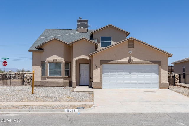10793 Blue Sage Cir, El Paso, TX 79924 - view of front of property with stucco siding, fence, a garage, driveway, and central air condition unit