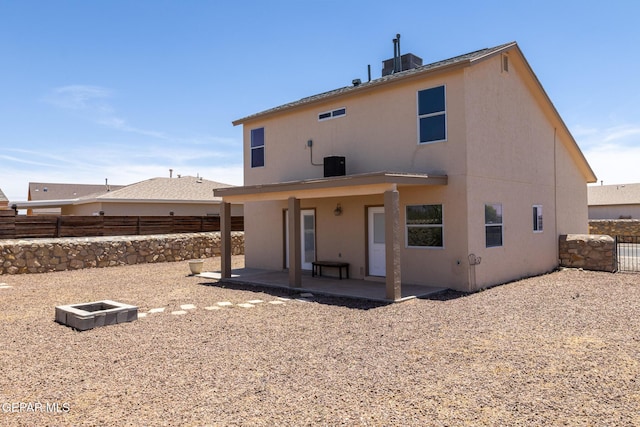 10793 Blue Sage Cir, El Paso, TX 79924 - back of property with a patio area, stucco siding, a fenced backyard, and central AC