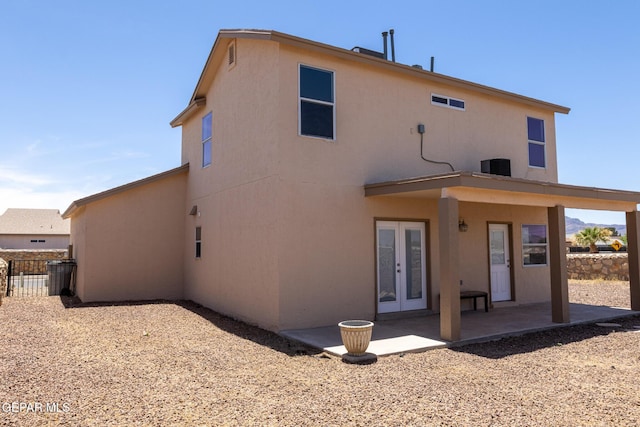 10793 Blue Sage Cir, El Paso, TX 79924 - rear view of house featuring french doors, a patio, stucco siding, and central air condition unit