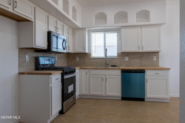 10793 Blue Sage Cir, El Paso, TX 79924 - kitchen featuring black gas stove, dishwashing machine, stainless steel microwave, a sink, and backsplash