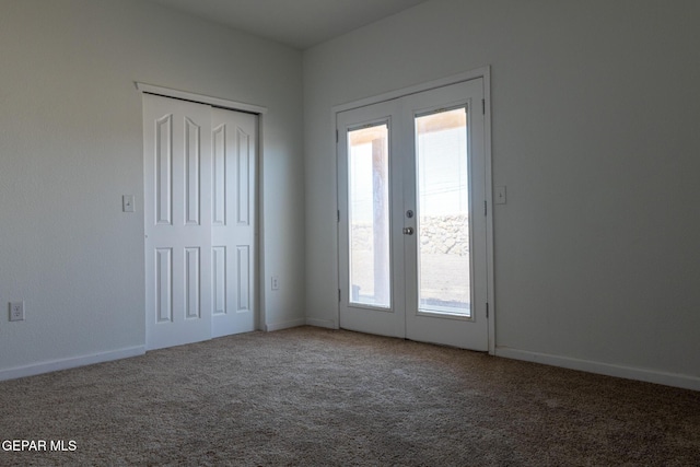 10793 Blue Sage Cir, El Paso, TX 79924 - unfurnished bedroom with multiple windows, carpet flooring, and french doors