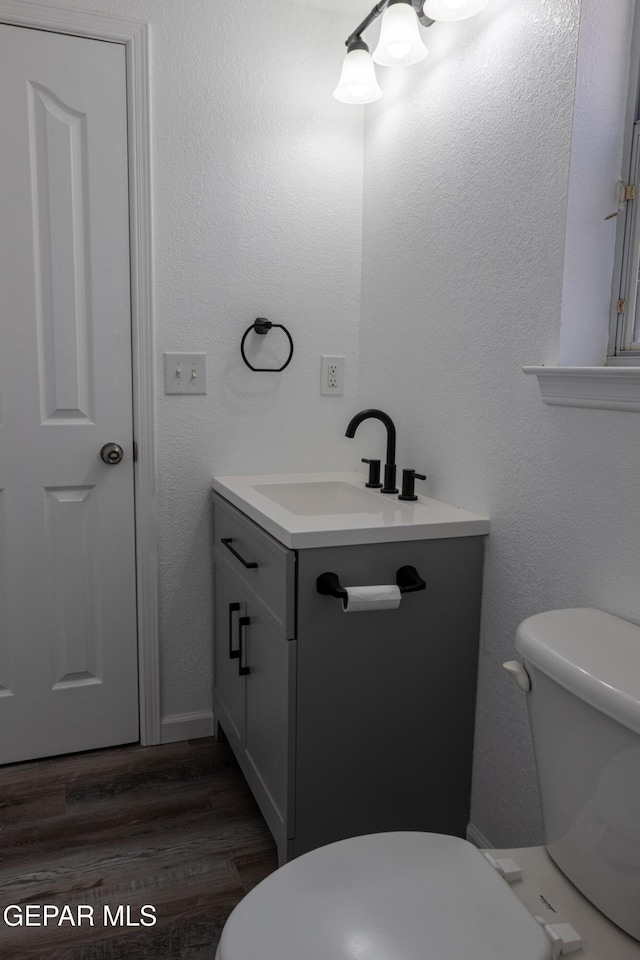 10793 Blue Sage Cir, El Paso, TX 79924 - bathroom featuring toilet, vanity, and wood finished floors