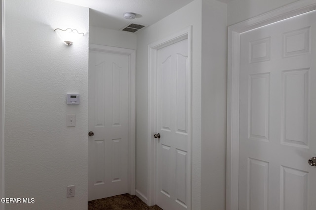 10793 Blue Sage Cir, El Paso, TX 79924 - corridor featuring dark carpet
