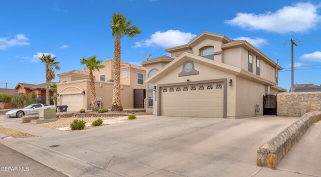 3208 Cascade Point Dr, El Paso, TX 79938 - view of front of property with stucco siding, concrete driveway, and a gate