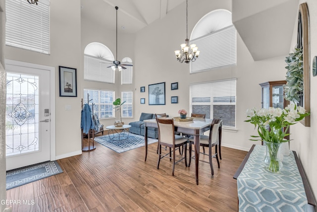 3208 Cascade Point Dr, El Paso, TX 79938 - dining area with high vaulted ceiling, baseboards, plenty of natural light, a chandelier, and wood finished floors