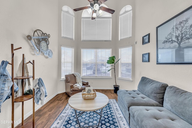 3208 Cascade Point Dr, El Paso, TX 79938 - living room featuring ceiling fan, a towering ceiling, wood finished floors, and baseboards