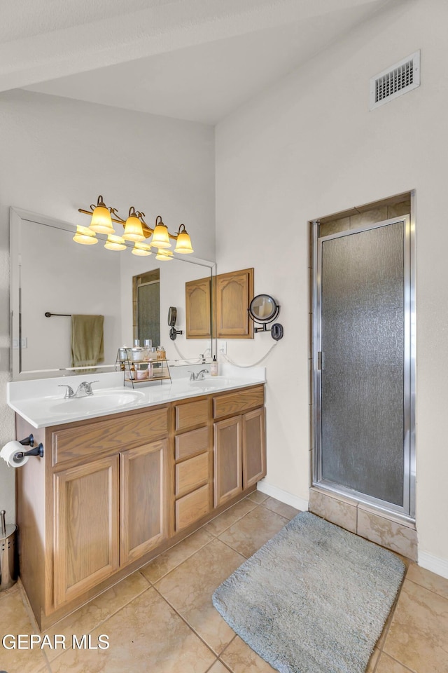 3208 Cascade Point Dr, El Paso, TX 79938 - full bath with a shower stall, tile patterned floors, double vanity, and baseboards