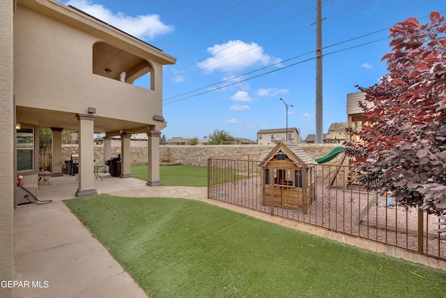 3208 Cascade Point Dr, El Paso, TX 79938 - view of yard featuring a patio area, a balcony, and a playground