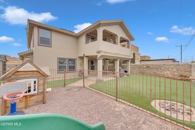 3208 Cascade Point Dr, El Paso, TX 79938 - back of property with a balcony, stucco siding, and a patio