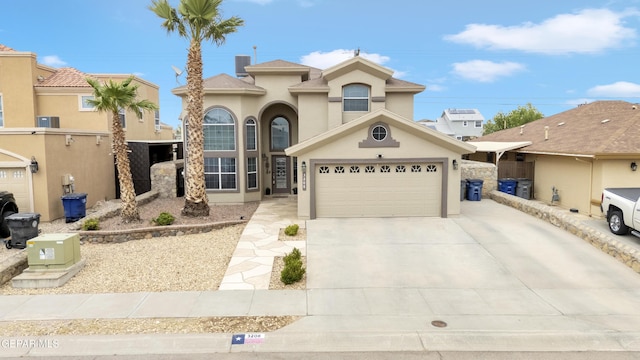 3208 Cascade Point Dr, El Paso, TX 79938 - mediterranean / spanish home with stucco siding, concrete driveway, and central air condition unit
