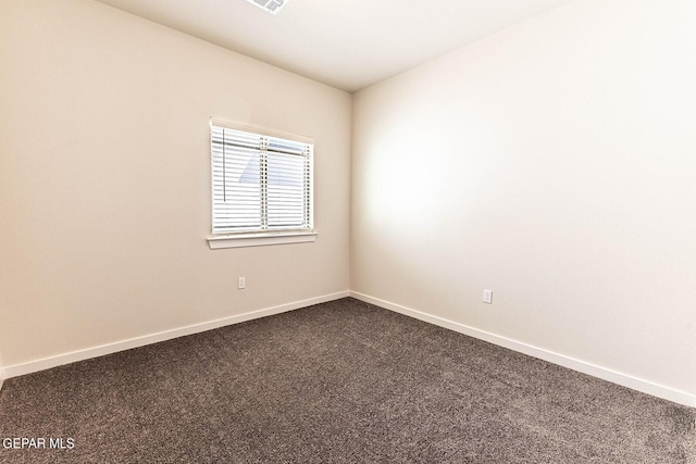 3801 Course St, El Paso, TX 79938 - empty room with dark carpet and baseboards