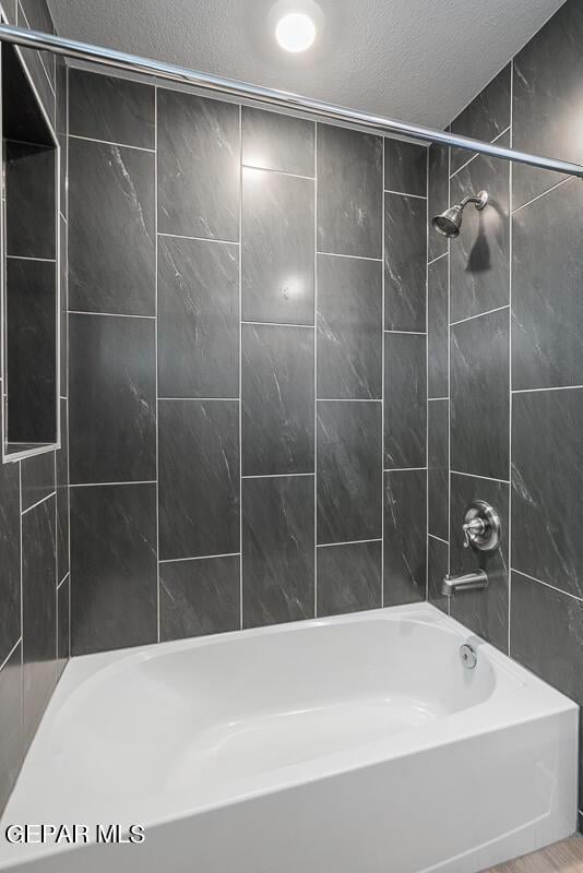 3800 Peak Pl, El Paso, TX 79938 - bathroom with shower / bath combination and a textured ceiling