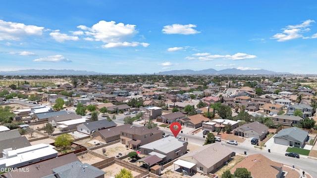 aerial view of residential area with a mountainous background