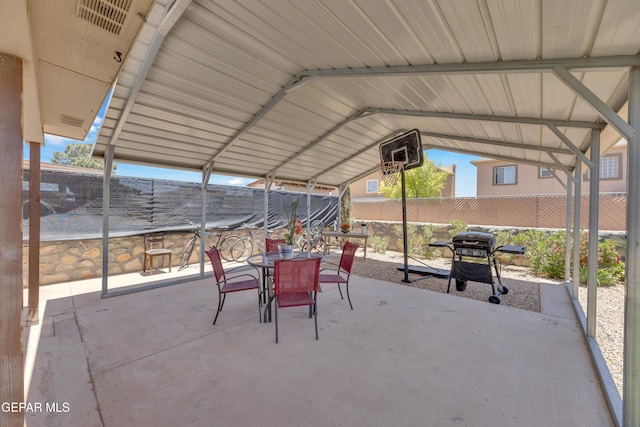 view of patio / terrace with outdoor dining area, area for grilling, and fence