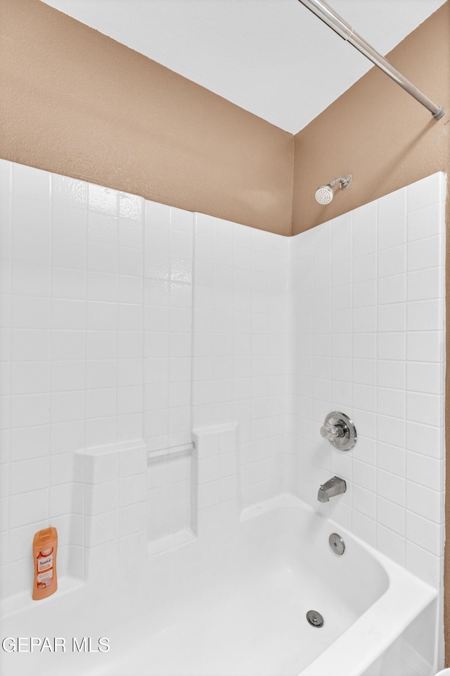 full bath featuring tub / shower combination