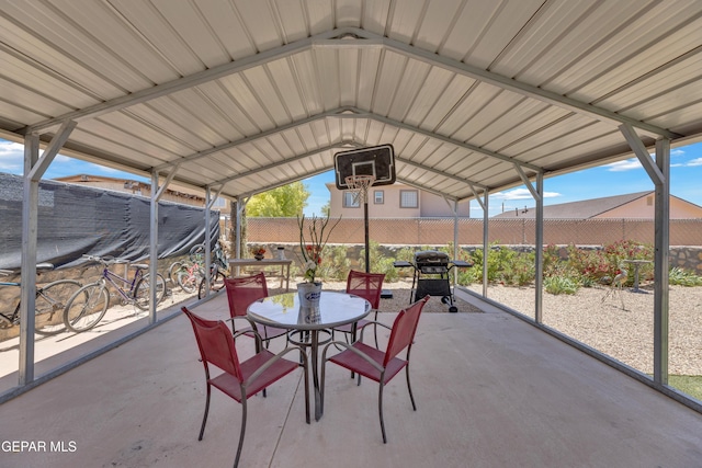 view of patio / terrace featuring outdoor dining space, a fenced backyard, and a grill