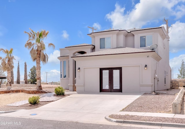 3165 Diego Aidan Dr, El Paso, TX 79938 - view of front of property featuring french doors, stucco siding, and concrete driveway