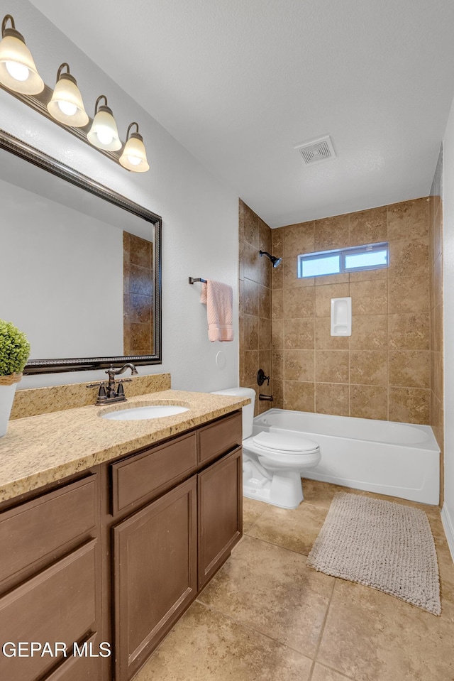 3165 Diego Aidan Dr, El Paso, TX 79938 - full bath featuring washtub / shower combination, vanity, and toilet