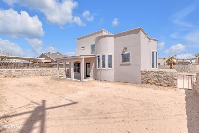 3165 Diego Aidan Dr, El Paso, TX 79938 - rear view of property featuring a fenced backyard, a patio, and stucco siding