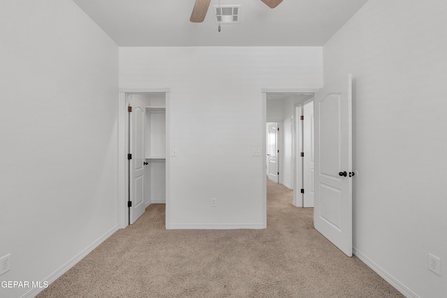 3165 Diego Aidan Dr, El Paso, TX 79938 - unfurnished bedroom with carpet flooring, baseboards, a ceiling fan, and a walk in closet