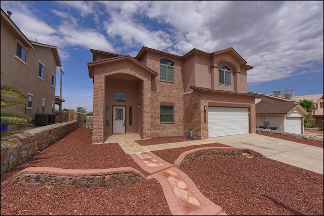 view of front facade featuring an attached garage, concrete driveway, brick siding, cooling unit, and fence