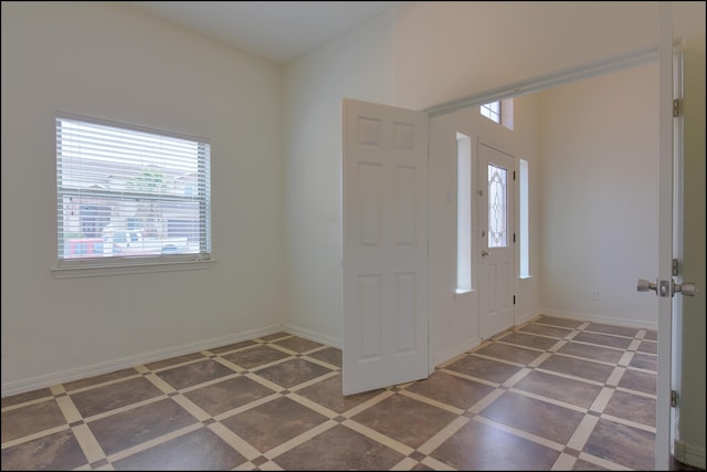 entryway featuring plenty of natural light and baseboards