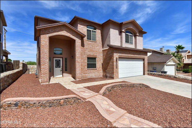1493 Luz De Sol Dr, El Paso, TX 79912 - traditional home featuring concrete driveway, a garage, brick siding, and fence