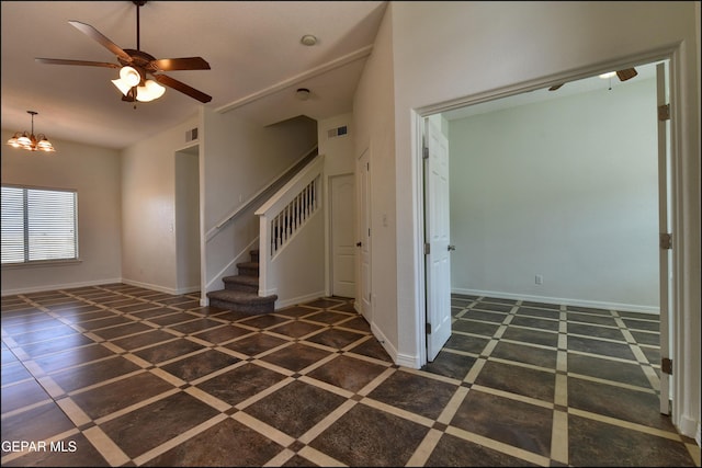 1493 Luz De Sol Dr, El Paso, TX 79912 - foyer with stairway, vaulted ceiling, a chandelier, baseboards, and inlaid floor details