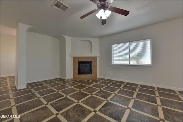 1493 Luz De Sol Dr, El Paso, TX 79912 - unfurnished living room featuring ceiling fan, a fireplace, baseboards, and inlaid floor details