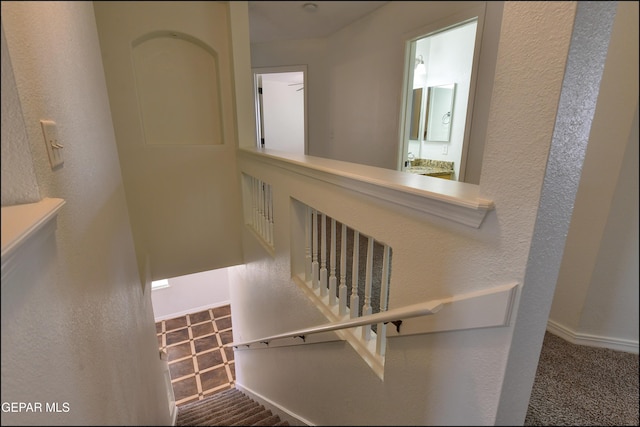 1493 Luz De Sol Dr, El Paso, TX 79912 - stairs with carpet floors, baseboards, and a textured wall