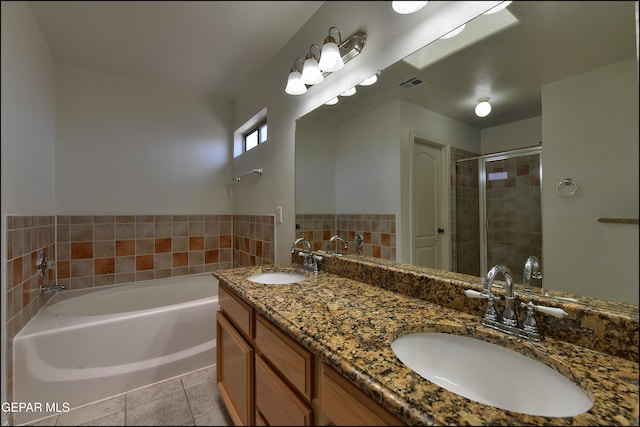 1493 Luz De Sol Dr, El Paso, TX 79912 - full bathroom with a shower stall, tile patterned flooring, a bath, and double vanity