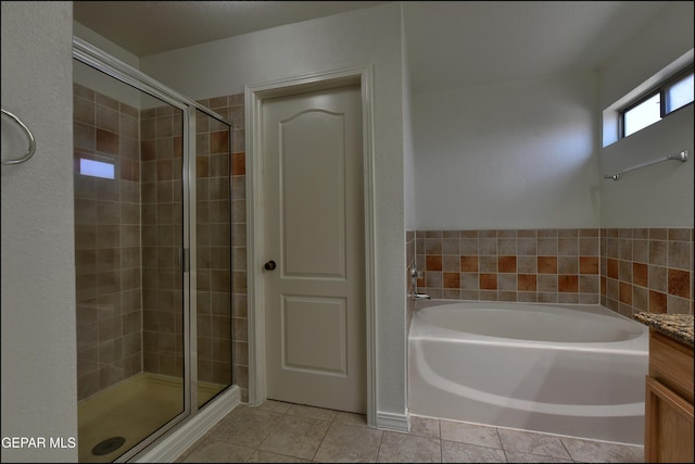 1493 Luz De Sol Dr, El Paso, TX 79912 - full bathroom with a stall shower, a garden tub, and tile patterned floors