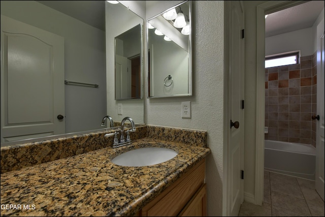 1493 Luz De Sol Dr, El Paso, TX 79912 - full bathroom with tile patterned floors, vanity, and tub / shower combination
