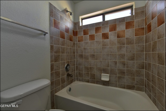 1493 Luz De Sol Dr, El Paso, TX 79912 - full bath with toilet, shower / bathtub combination, and a textured wall