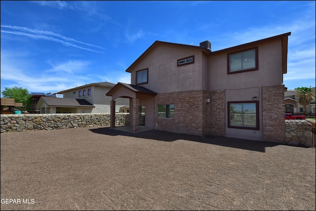 1493 Luz De Sol Dr, El Paso, TX 79912 - rear view of house with stucco siding and brick siding