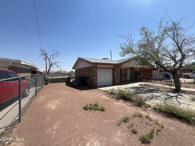 9125 Elgin Dr, El Paso, TX 79907 - view of side of property featuring a garage, brick siding, fence, and concrete driveway