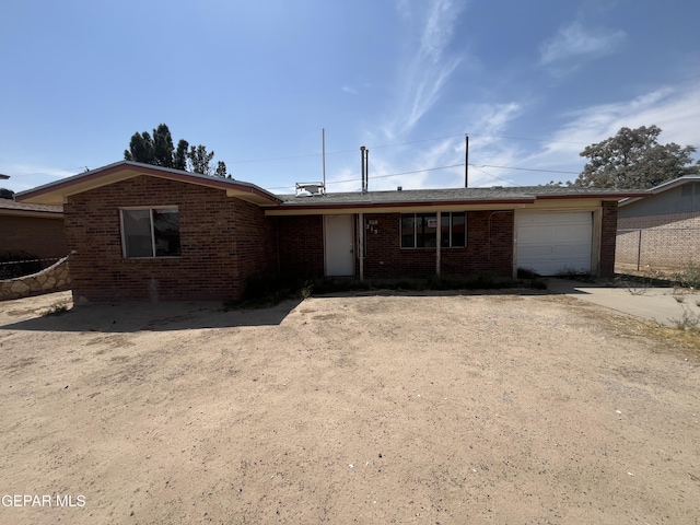 215 Maravilla Dr, El Paso, TX 79907 - ranch-style house featuring an attached garage, brick siding, fence, and driveway