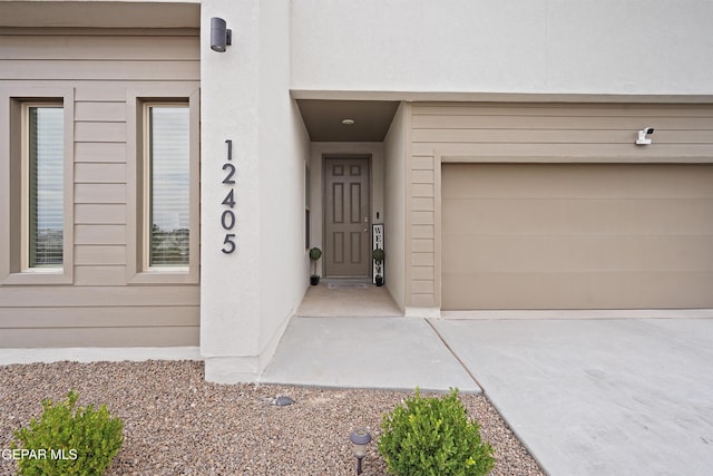 12405 Northumberg Dr, El Paso, TX 79928 - doorway to property with a garage and concrete driveway
