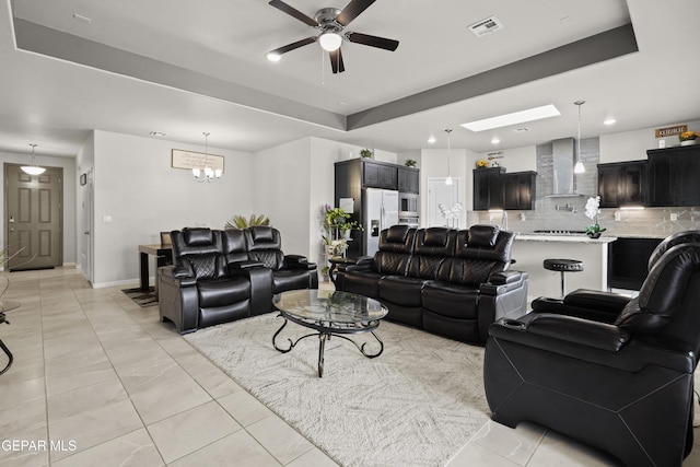 12405 Northumberg Dr, El Paso, TX 79928 - living area featuring ceiling fan, a tray ceiling, recessed lighting, a chandelier, and baseboards