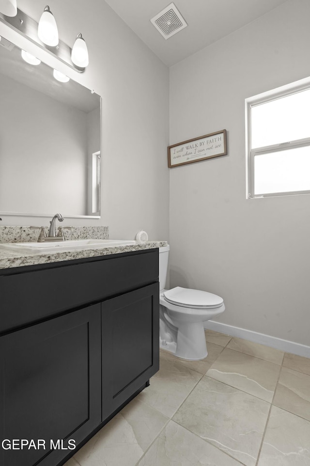 12405 Northumberg Dr, El Paso, TX 79928 - bathroom with toilet, vanity, baseboards, and marble finish floors