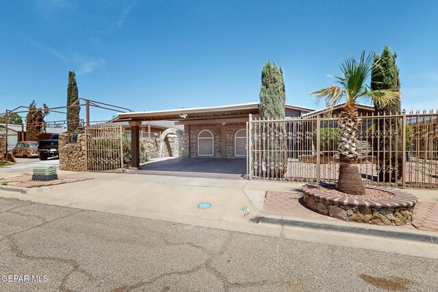 10912 Duke Snider Cir, El Paso, TX 79934 - view of front of home with a fenced front yard, a gate, and driveway