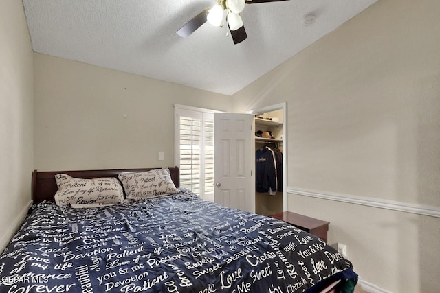 10912 Duke Snider Cir, El Paso, TX 79934 - bedroom with baseboards, vaulted ceiling, a spacious closet, a ceiling fan, and a closet