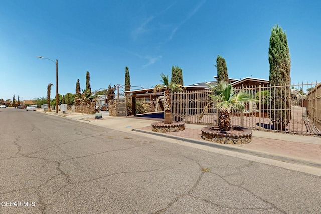 10912 Duke Snider Cir, El Paso, TX 79934 - obstructed view of property featuring fence and a gate